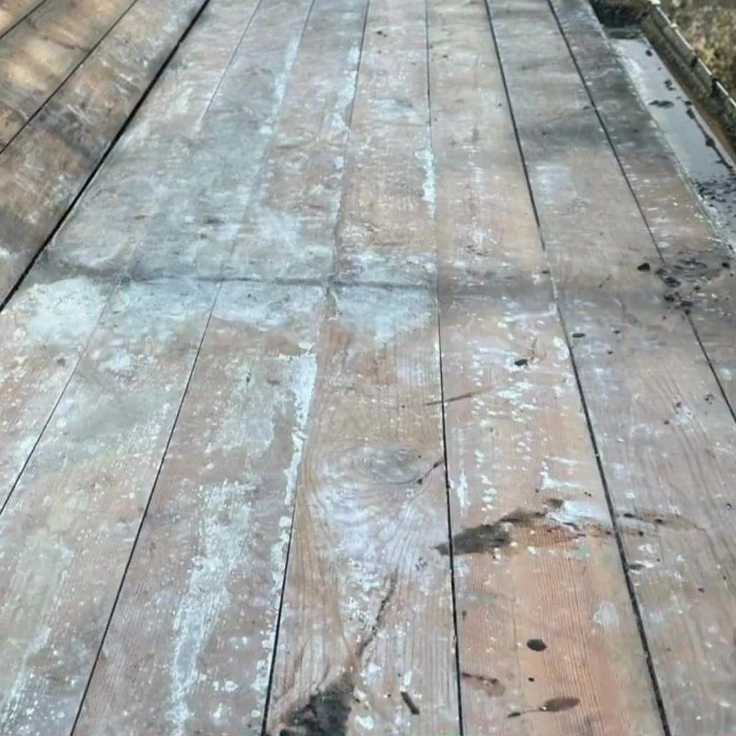 The same flat roof stripped back to the old timber boards