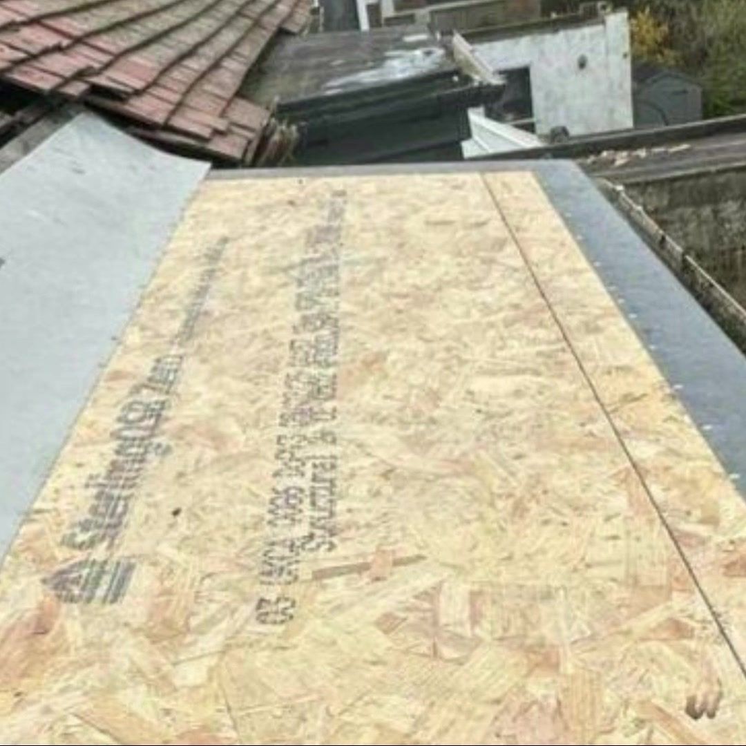New OSB boards laid as the deck of the flat roof