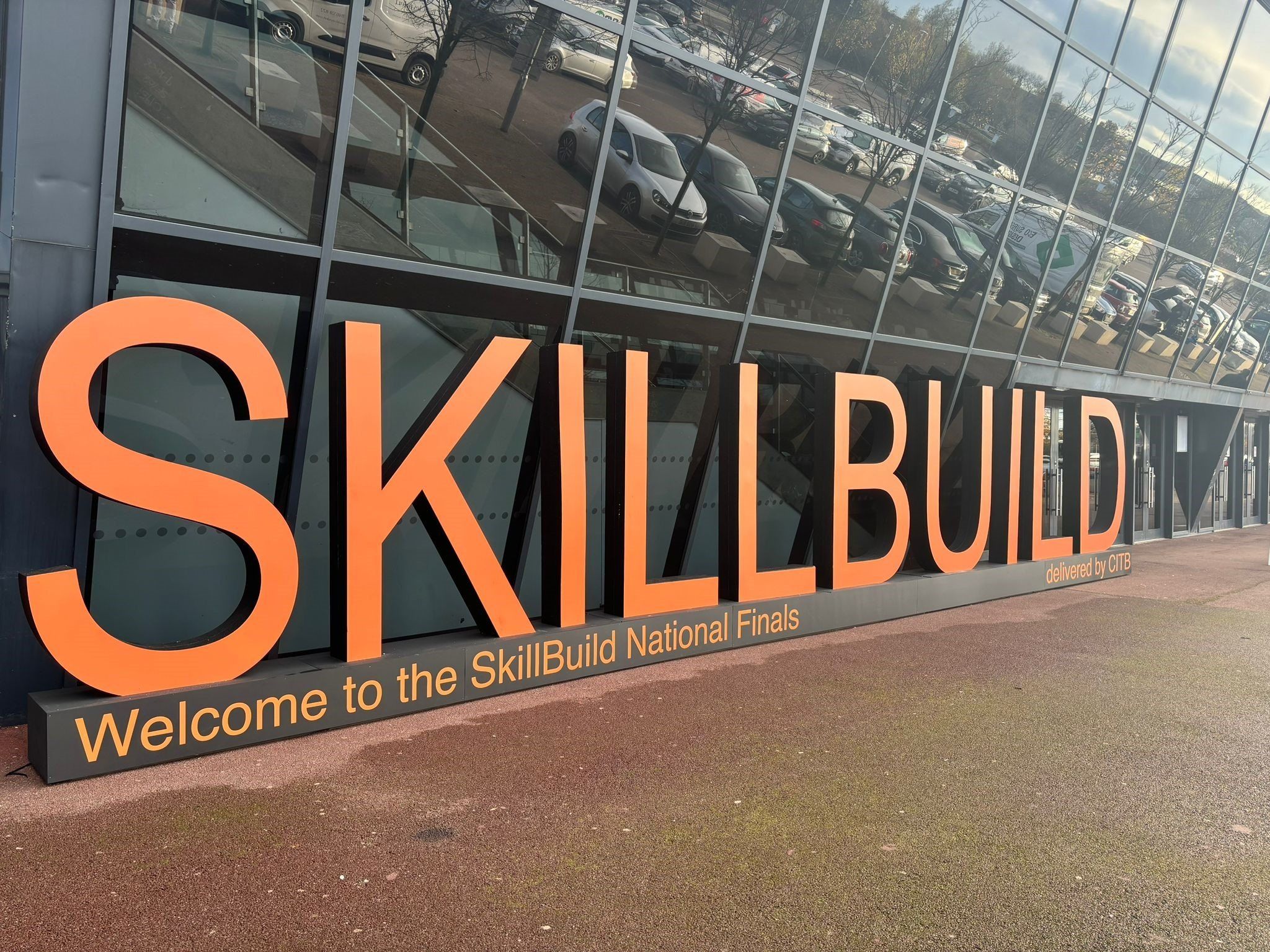 The giant orange SkillBuild letters outside the hall, with a sign saying Welcome to the SkillBuild National Finals
